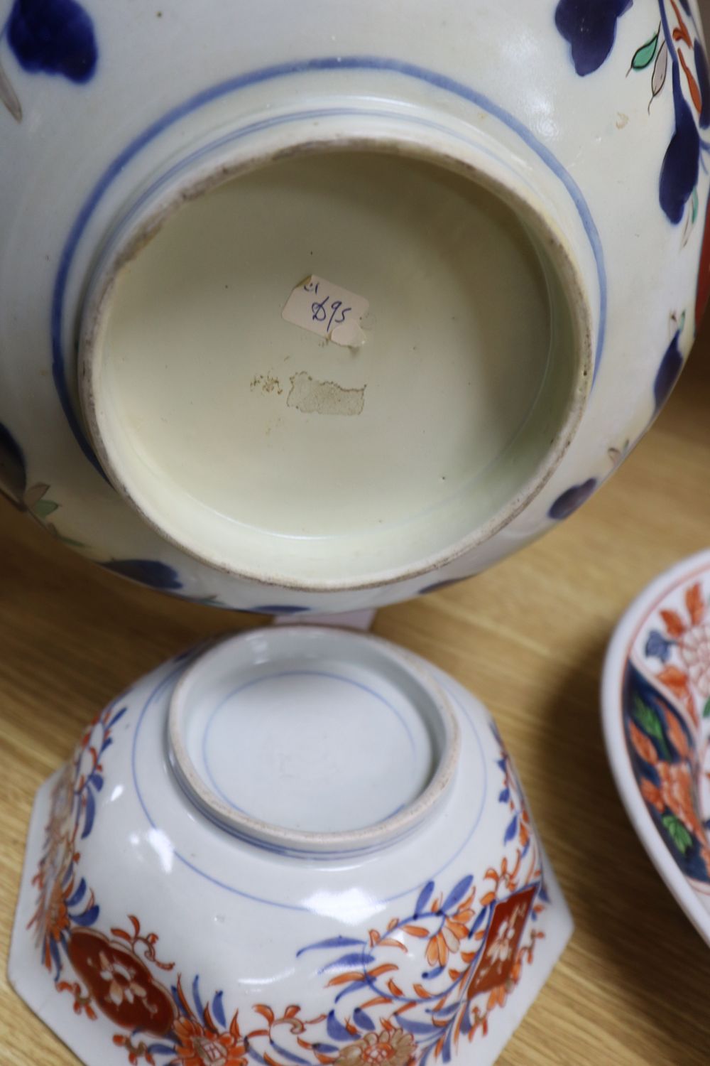 A Japanese Imari oval dish with six-character mark to base and six other items of Japanese Imari